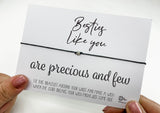 a person holding a card with a message on it