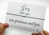 a person holding a card with a message on it