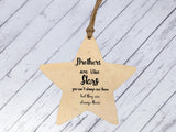 a wooden star ornament with a message on it