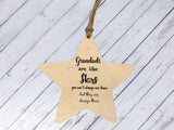 a wooden star ornament hanging on a string